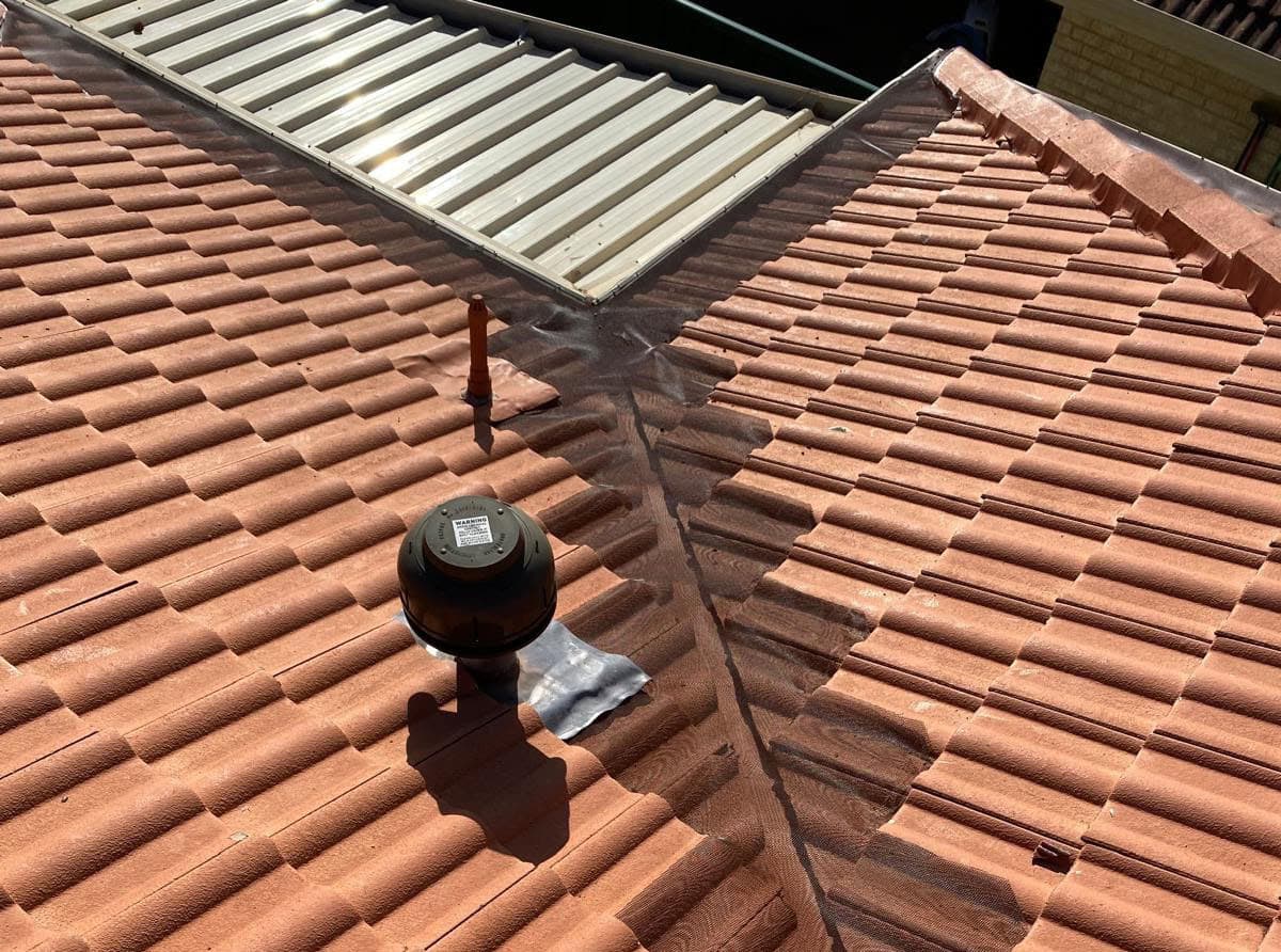 Wider mesh gutter guard installed on red tile valley roof