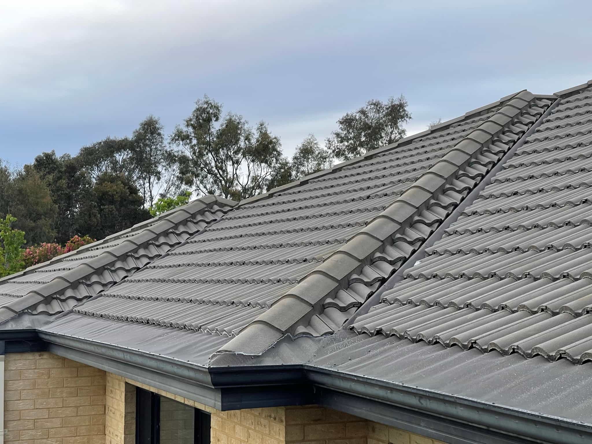 Aluminium mesh gutter guard installed on tiled roof Perth